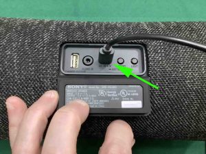 Picture of the power cord inserted into the USB-C input port.