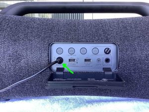 Picture of the charging cord attached to the back of the Sony SRS XG500 speaker.