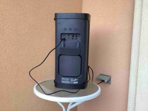 Picture of the back of the Sony SRS XP500 speaker, showing it connected to AC power.