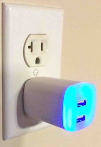 Picture of the GE Jasco dual port USB wall charger front view as it operates.