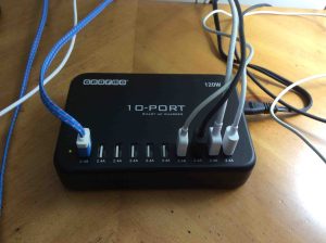 Picture of the Gearmo 10 Port Smart AC charger ICS 10P HO operating, with some cables connected to it.